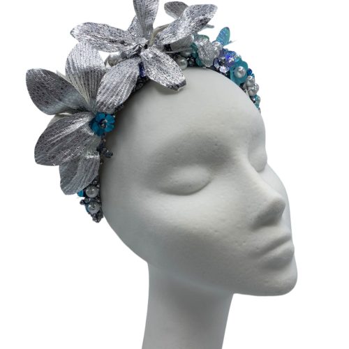 Blue and turquoise crown with silver leaf detail.